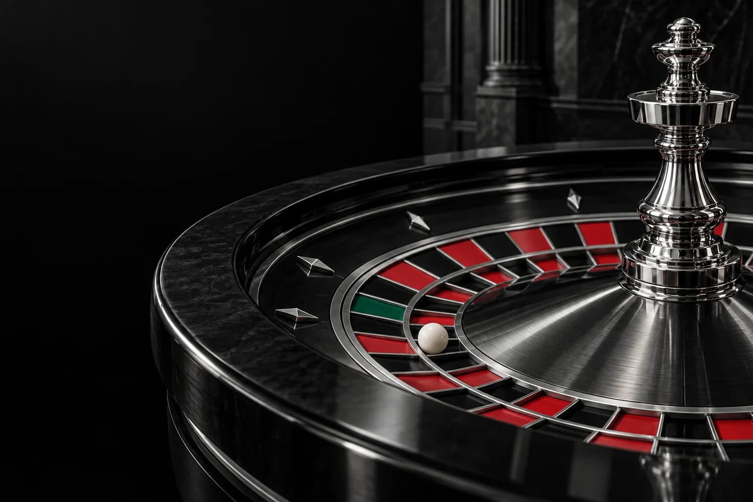 Close-up of a silver roulette wheel and white ball